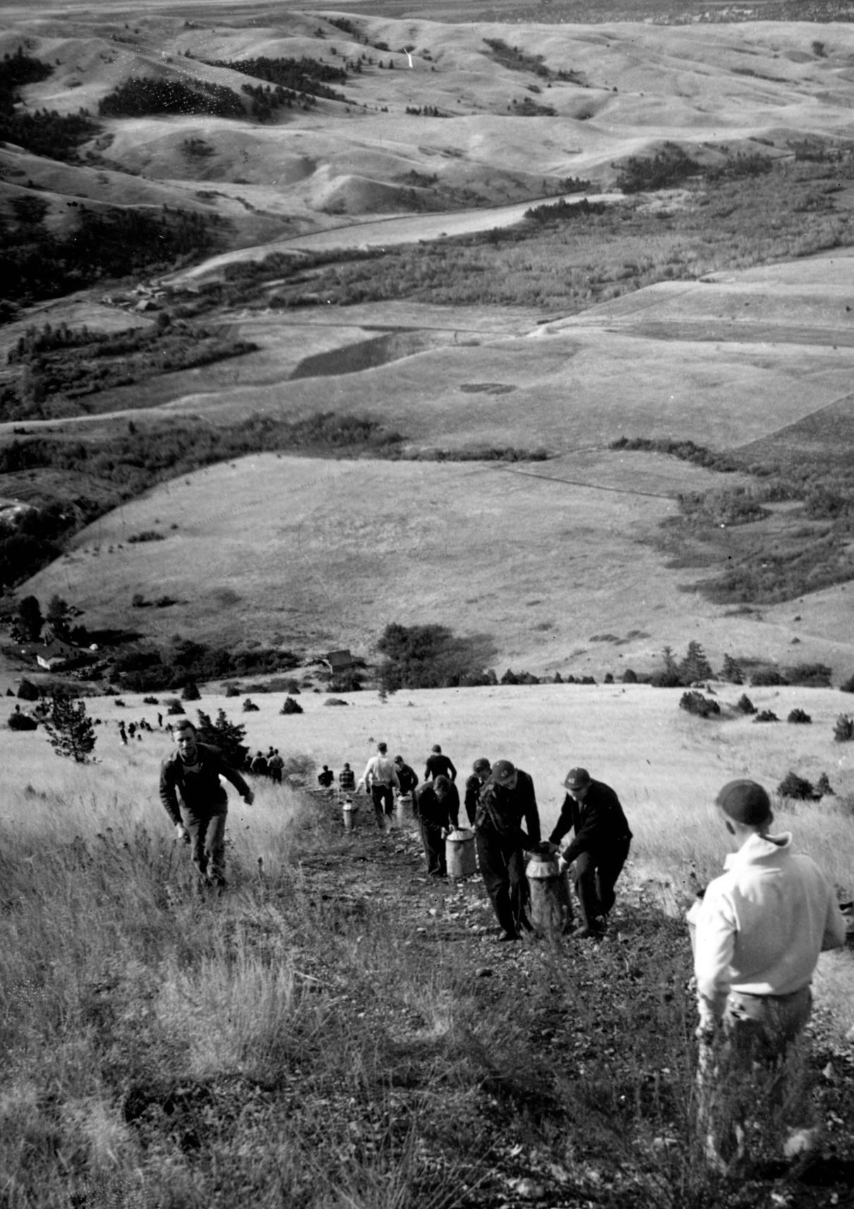 Students hauling whitewash up Mount Baldy